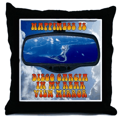 A throw pillow. The text says "Happiness
                    is Diego Garcia in my Rear View Mirror"!