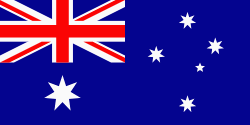 Australian National Flag. The RAN flew the Royal
                  Navy White Ensign at the time.