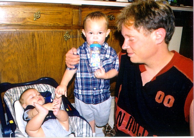 Uncle Eric with
                  Conner and Geoffrey, 2003